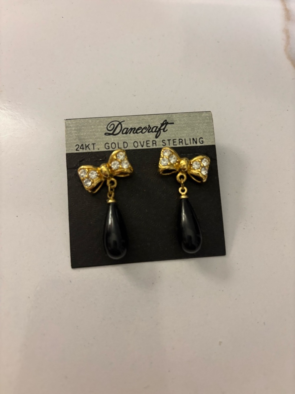 Gold Bow Drop Earrings with Black Teardrops